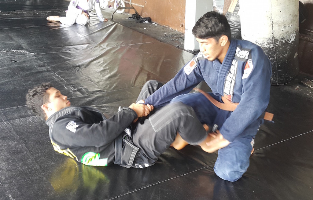 Jon Tuck showing Aguon some Jiu Jitsu moves at the Spike 22 Academy. Aguon will fight this weekend at PXC 51 in Manila. (courtesy photo)