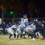 Raiders QB Danny Manibusan sets up his offense in the first quarter. (photo by Joey Blas)