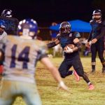 Angels RB Marvin Manibusan takes the handoff and picks up 5 yards on the play. (photo by Joey Blas)