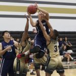 Kobe Sotelo (#4 shooting) attempts a highly contested layup. (photo by Raine Delos Reyes)