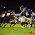 Player of the game #52 Rylan Napoleon and #92 Kobe Onedera sacks Gecko quarterback. (Photo by Michael Blas)