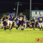 Gecko's QB Trystan Guerrero brushes off Friar defender. (Photo by Michael Blas)