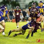GW defender tackles FD Friar's Brian Anderson for a fumble. (Photo by Michael Blas)