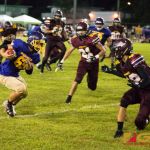 Gecko runner attempts to juke Friar defense. (Photo by Michael Blas)