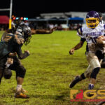 GW Geckos Enrique Macias scrambles and gets the first down as he runs out of bounds. (Photo by Michael Blas)
