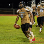 JFK Islander's Justin Camacho celebrates after scoring a touchdown early in the third quarter. (Photo by Michael Blas)