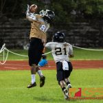 JFK Islander's Juan Sarmiento attempts to complete a pass in the end zone while Tiyan Titan's Davin Mojica tails hims. (Photo by Michael Blas)
