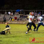 Okkodo Bulldog's Nick Panginiban catches an interception late in the first half of the game. (Photo by Michael Blas)