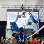 Norte Dame Royal's Austia Mendiola spikes while St. Paul Christian Warrior's Niah Siguenza attempts to block. (Photo by Michael Blas)