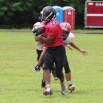 Dolphin Gabriel Stanley hauls in the pass to go untouched for an 80-yard touchdown. (photo by Robert Balajadia)