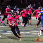 Southern High Dolphins John Topasna makes a big run for the first down early in the first quarter. (Photo by Michael Blas)