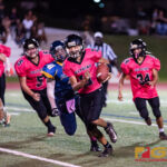 Southern High Dolphins QB Ethaniel Escuadra keeps the ball and runs for the first down. (Photo by Michael Blas)