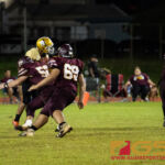 Father Duenas Friars Rylan Napoleon gets a sack on Tiyan Titans John Angoco. (Photo by Michael Blas)