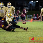 Father Duenas Friars Rylan Napoleon force fumbles the ball on a sack to the Tiyan Titans John Angoco. (Photo by Michael Blas)