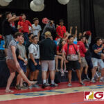 St. John's Knights supporters cheer on their home team as they take the second set of the game. (Photo by Michael Blas)