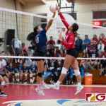 AOLG Cougars Theisen Taimanglo and St. John's Knights Angeline Del Carmen fight to knock the ball over onto the opposing teams side. (Photo by Michael Blas)