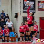 St. John's Knights Hallie Wigsten gets back onto the court after an injury during warm ups. (Photo by Michael Blas)