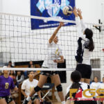 George Washing Geckos Evita Laguana looks for a kill while St. Paul Warriors Niah Siguenza attempts to block. (Photo by Michael Blas)