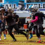 Raiders Tristan Jay Burgos breaks through a block. (Photo by Michael Blas)