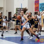 Academy Cougars Mia San Nicolas inches her way towards the net with Guam High Panthers Alexia Brown keeping the pressure on her. (Photo by Michael Blas)