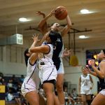 St. Paul Warriors Monica Giger snatches another defensive rebound. (Photo by Michael Blas)