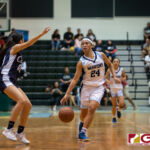 St. Paul Warriors Niah Siguenza dribbles past the defense for a shot in the paint. (Photo by Michael Blas)