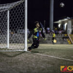 Jfk Islanders Goal Keeper Allan Aranas gets ready to defend the ball in his territory. (photo by Michael Ebio)