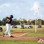 Simon Sanchez Sharks Tyler Enaligo knocks one deep in the back field. (Photo by Michael Blas)