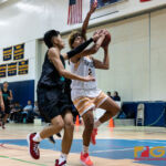 Guam High Panthers Travon Jacobs looks for a shot while Southern High Dolphins Elijah Cruz contests. (Photo by Michael Blas)