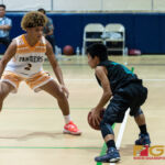 Southern High Dolphins Javier Duenas holds onto the ball as the Dolphins set up the play. (Photo by Michael Blas)