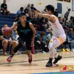 Southern High Dolphins Kyler Aflleje maintains possession of the ball as he looks to set up the play. (Photo by Michael Blas)