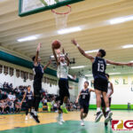 JFK Islanders Jerry Ngiraremiang works the open space to add two points onto the board. (Photo by Michael Blas)