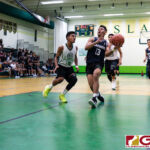 St. Paul Warriors Jahmar White loads up for a shot at the bucket on the fast break. (Photo by Michael Blas)