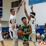 JFK Islanders King Karl De Mesa gets through the Harvest Eagles defense for a shot at the bucket. (Photo by Michael Blas)