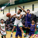 JFK Islanders Karl De Mesa flies past the GW defense to knock in another two points. (Photo by Michael Blas)