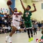 Okkodo Bulldogs Nico Bonita gets a shot off while JFK Islanders Jerry Ngiraremiang contests. (Photo by Michael Blas)
