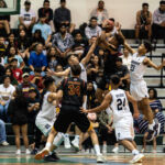 FD Friars Tony Quinene attacks the basket while St. Paul Warriors Nich Fermin and Reo Aiken look to block. (Photo by Michael Blas)