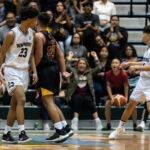 St. Paul Warriors Reo Aiken and FD Friars Christian Leon Guerrero stay heated in the final minutes of the game. (Photo by Michael Blas)