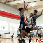 St. Paul Warriors Brandon Soulik looks for the basket as FBLG Hawks Gedfft Gozum continues his heavy defense. (Photo by Michael Blas)