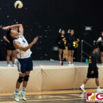 Harvest Eagles Jacob Oshiro serves to the home team Titans early in the third set of the game. (Photo by Michael Blas)