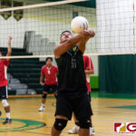 JFK Islanders Eddie Reyes keeps the ball in play after a return from the Knights. (Photo by Michael Blas)