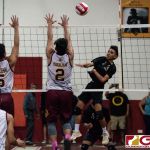 Tiyan Titans Calib Naputi spikes as Friars Brandon Soriano and Logan Pangelinan contests. (Photo by Michael Blas)