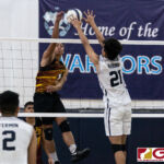 St. Paul Warriors John Kyle Rabino gets up for a block on FD Friars Brian Anderson. (Photo by Michael Blas)