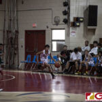 St. John Knights Pio Tolentino hustles down the court while the San Vicente Braves chase him down. (photo by Bout It Productions)