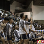 Harvest Eagles bench goes wild after their team keeps it to a close game. (photo by Bout It Productions)