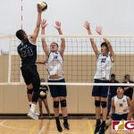 Tiyan Titans Jericho Snaer spikes down on the Eagles Chase Kieth and Michael Choi. (Photo by Michael Blas)