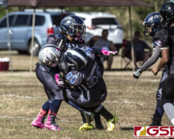 Sindalu Raiders Kimberlyn Tupaz gets sandwiched by Island Stunnerz Leeann Villagomez and Letrina Taimanglo. (photo by Bout It Productions)
