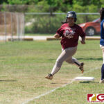 Islanders Pilar George clears third base and makes her way to home plate for a run in. (Photo by Michael Blas)