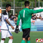 AJ DelaGarza and Dallas Jeffrey Jaye talk strategy in the middle of the first half. (Photo by Michael Blas)