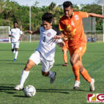 Guam Matao Isiah Lagutang fights off Bhutans Jigme Dorjee to maintain possession. (Photo by Michael Blas)